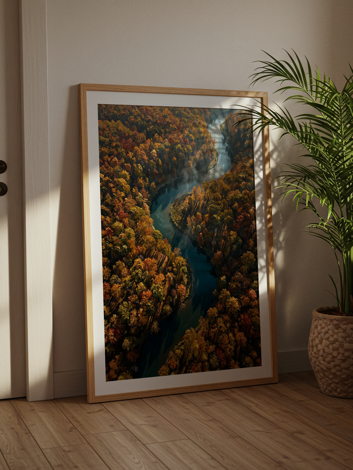 Autumn River – painterly aerial view of a river winding through an amber and gold autumn forest
