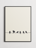 Birds on a Wire minimalist poster framed on a wall