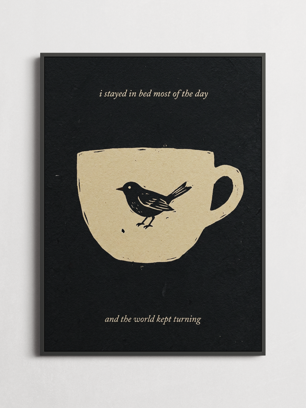 Stayed in Bed linocut typography poster framed on a wall