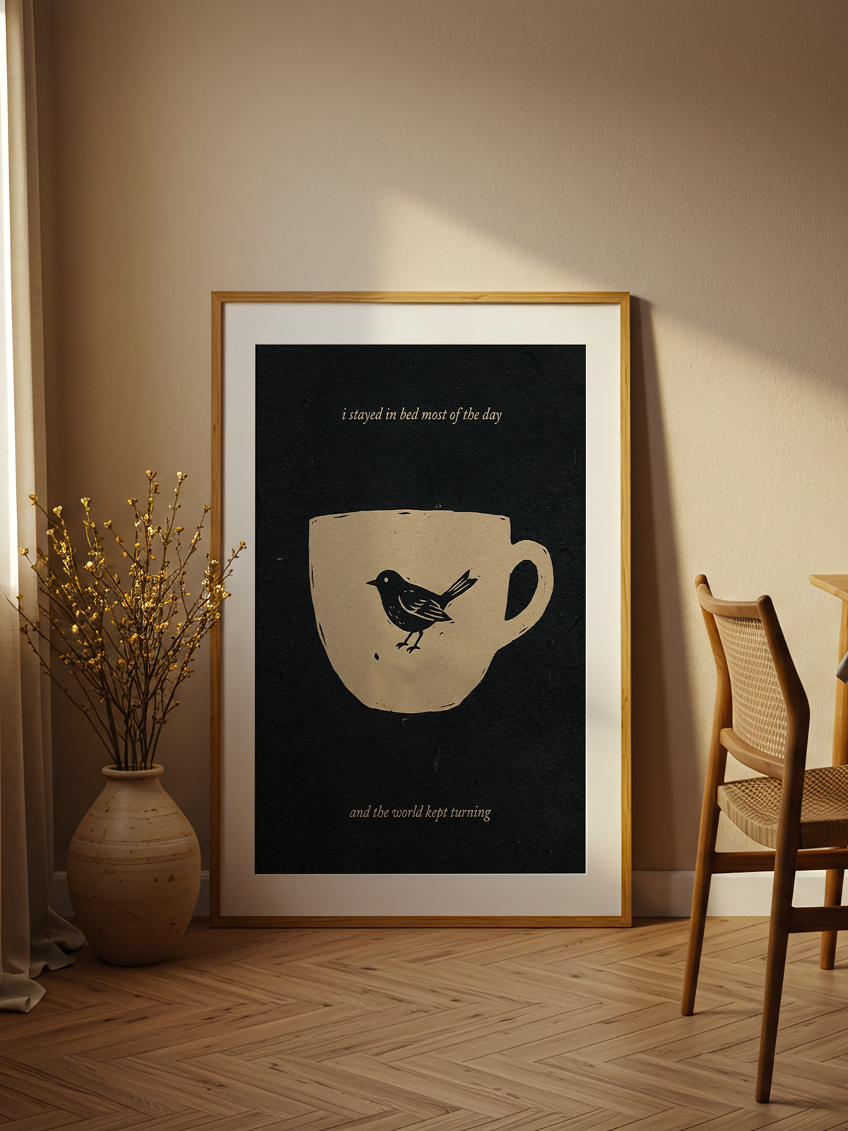Stayed in Bed – linocut poster of a small bird inside an oatmeal cup on deep charcoal with italic lettering